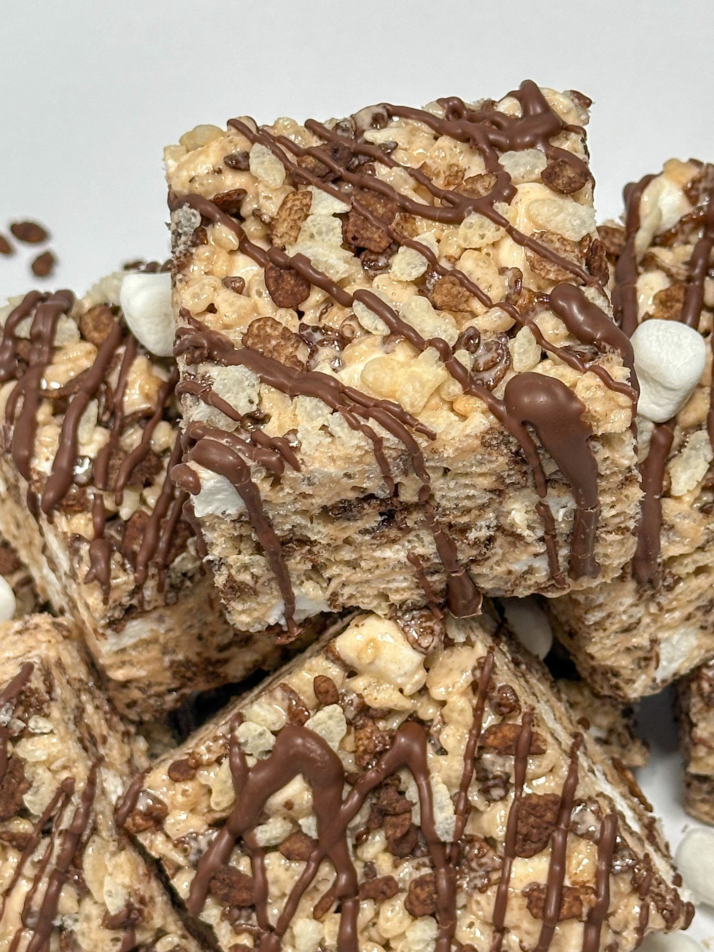 Custom chocolate cocoa pebbles rice crispy treat with personalized fondant topper