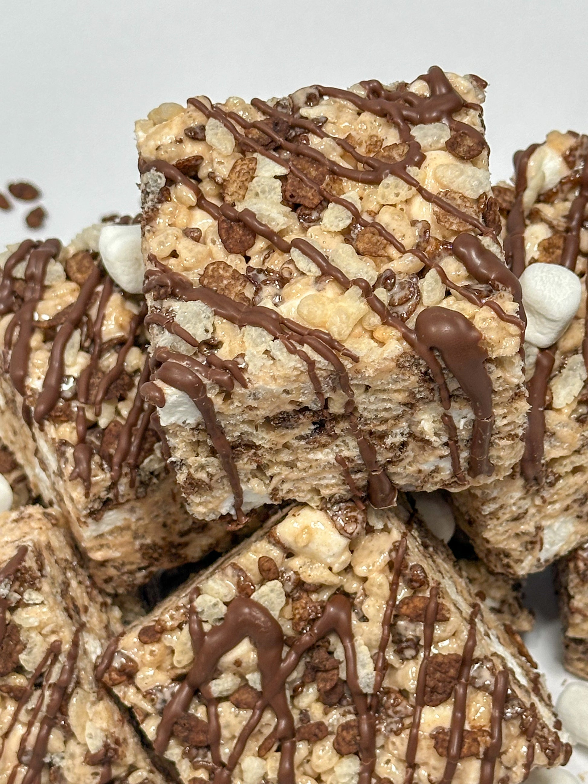 Custom chocolate cocoa pebbles rice crispy treat with personalized fondant topper